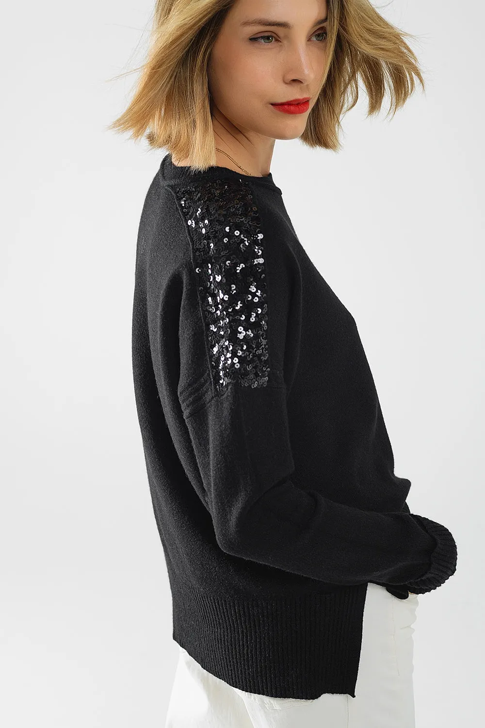Black long sleeves sweater with sequins on the shoulders