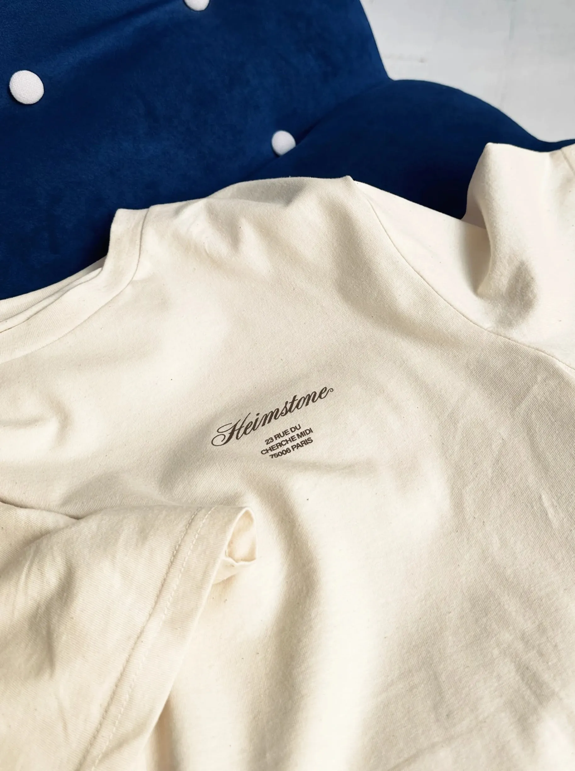 Collectible Unisex T-Shirt in Cream with Black Heimstone Logo