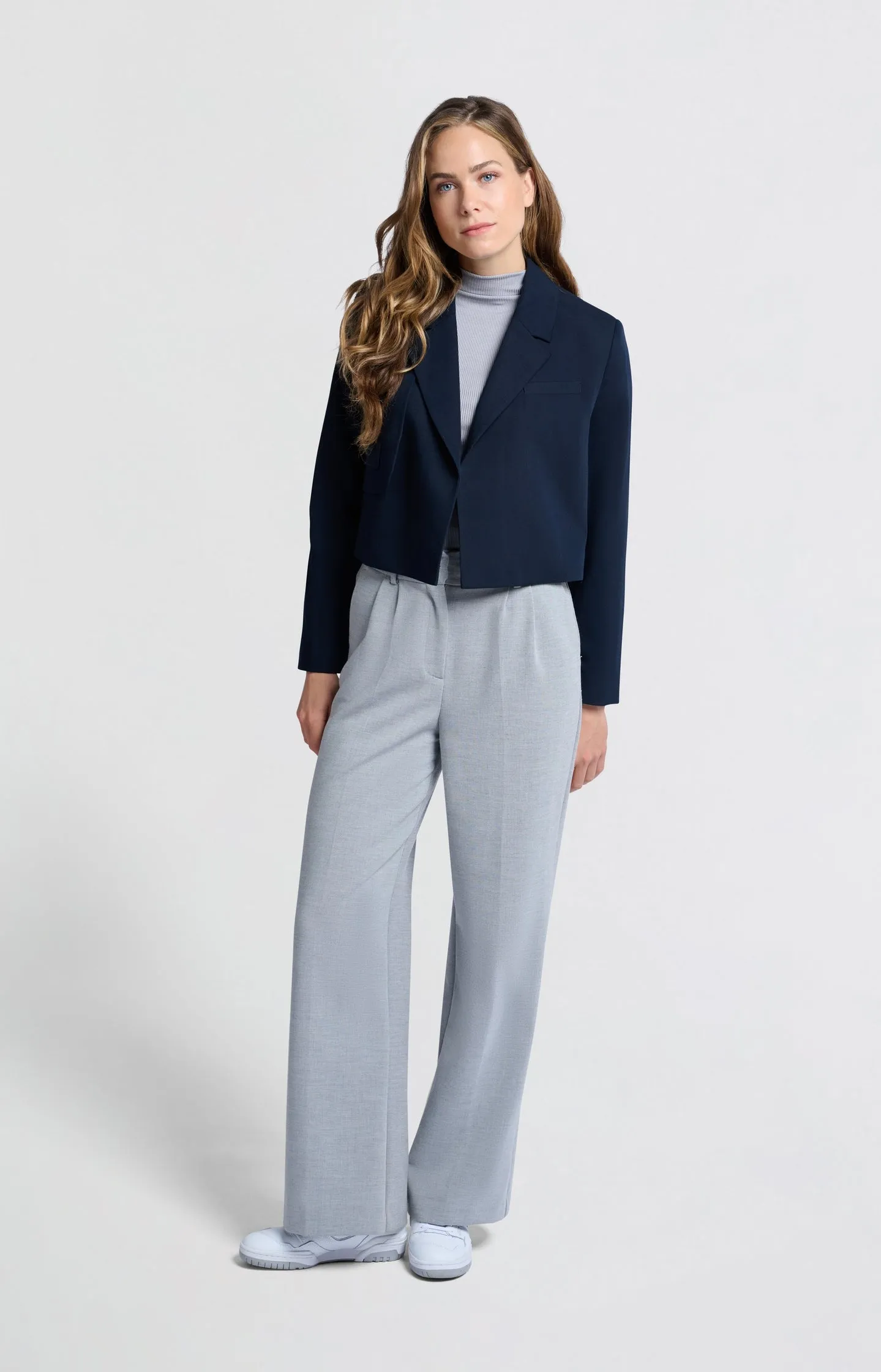 Dark blue woven cropped blazer with unique pocket detail