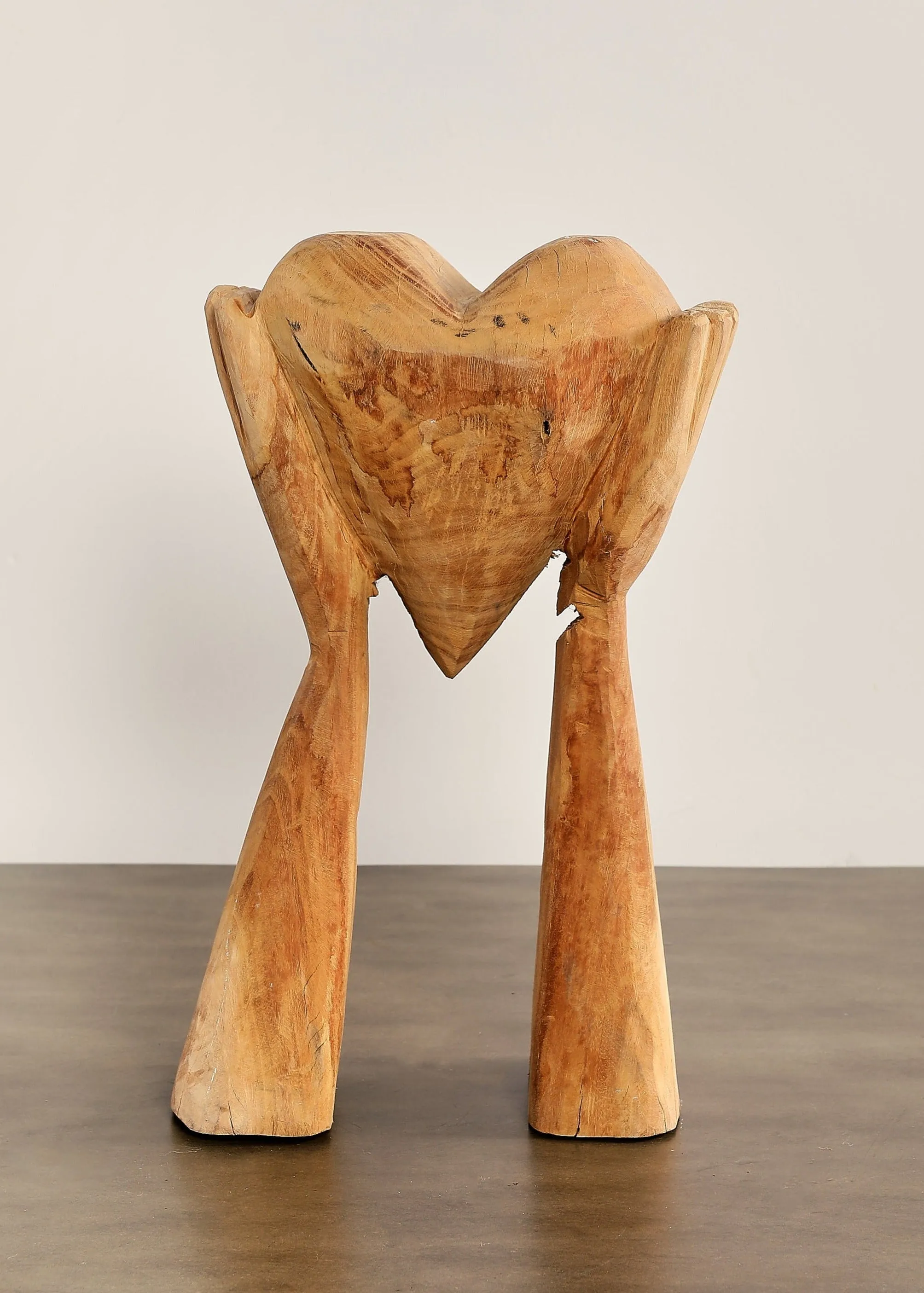 Hands Holding Heart Sculpture